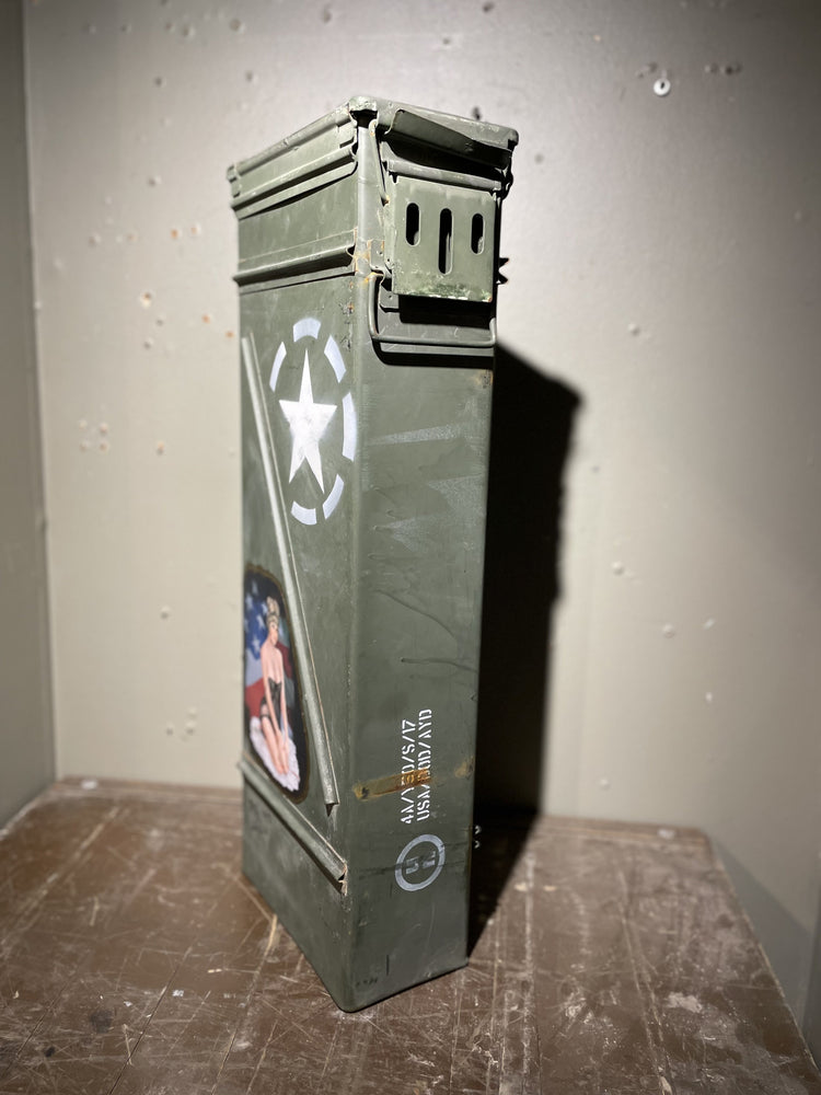 Vietnam ammo cannister with pin-up art